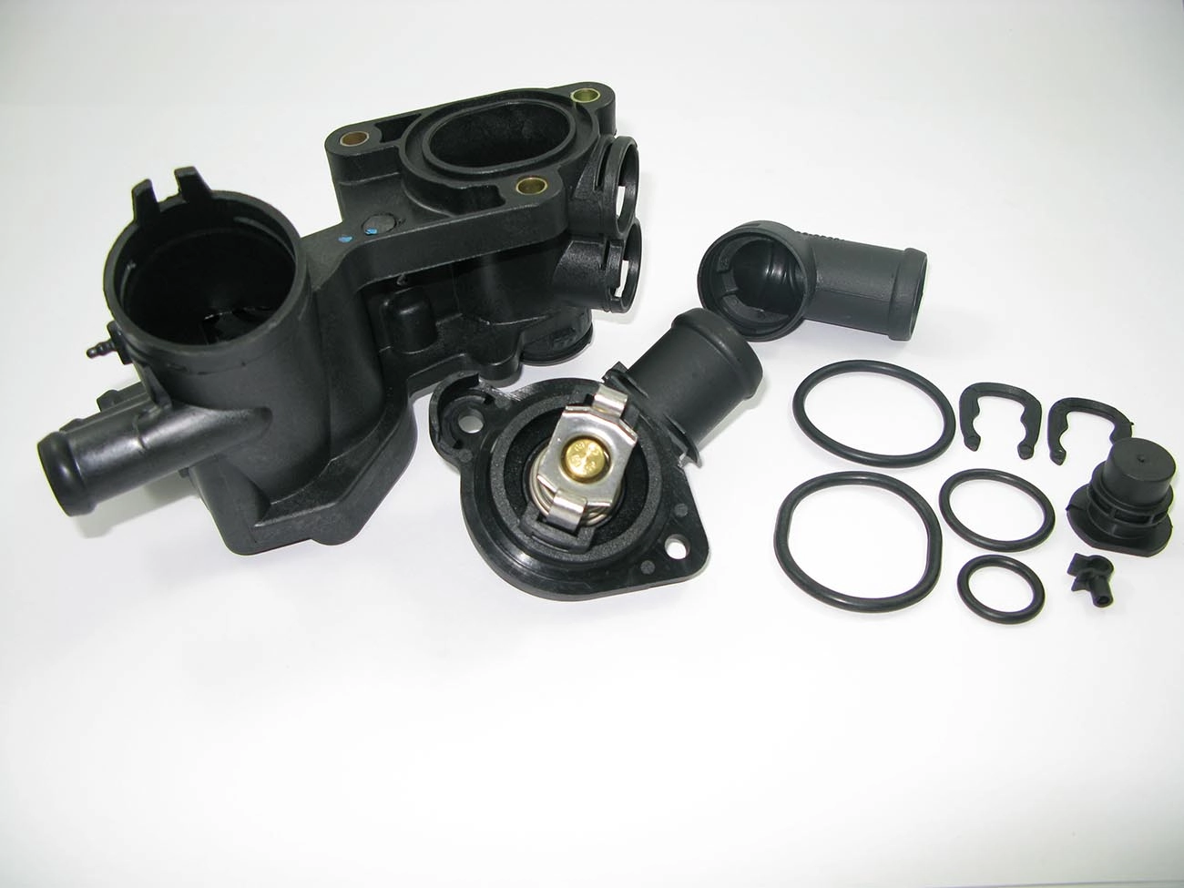 CARCAÇA/FLANGE PLÁSTICA COM VÁLVULA TERMOSTÁTICA CAVALETE ÁGUA VW GOL/VOYAGE/SAVEIRO 09/ FOX 03/ POLO 10/